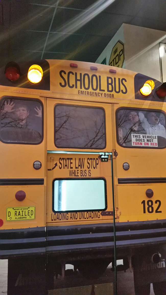 Oasis Travel Center-Back of School Bus with Kids in WindowJI.jpg